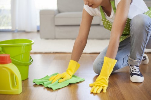 Technician applying carpet cleaning methods in a controlled environment